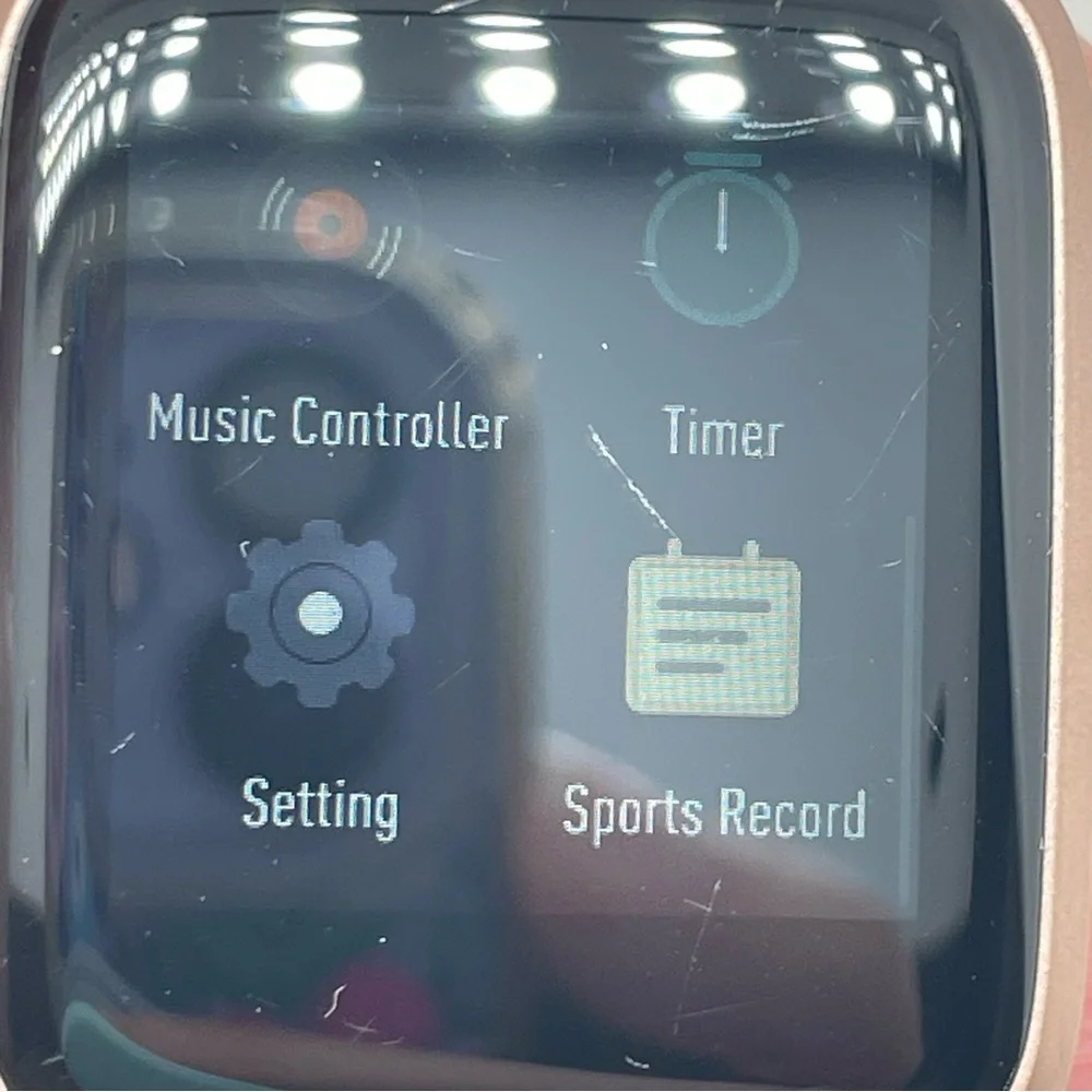 Smartwatch with Rose Gold Tone Pink Silicone Strap Turns On